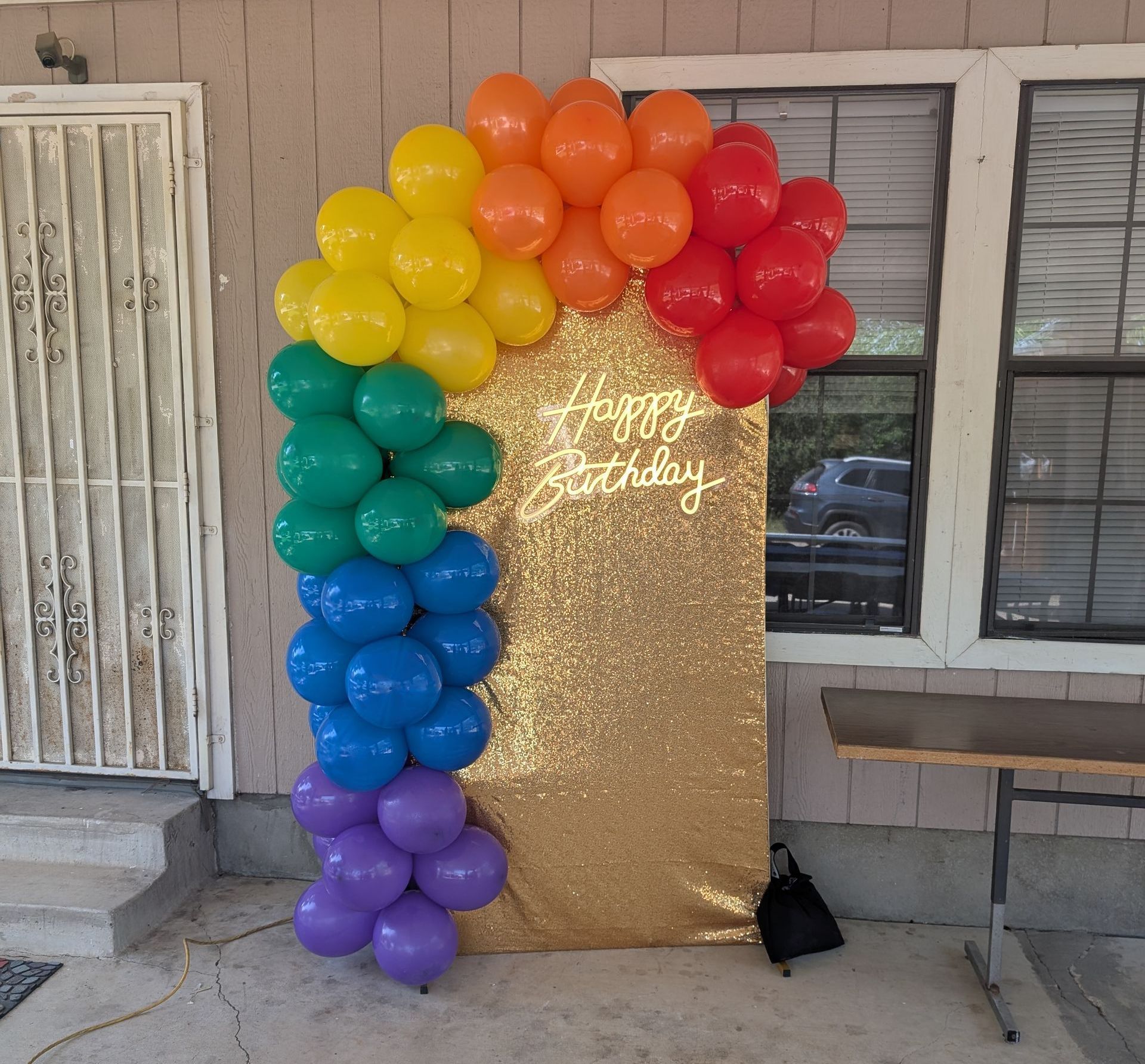 Rainbow balloon arch with