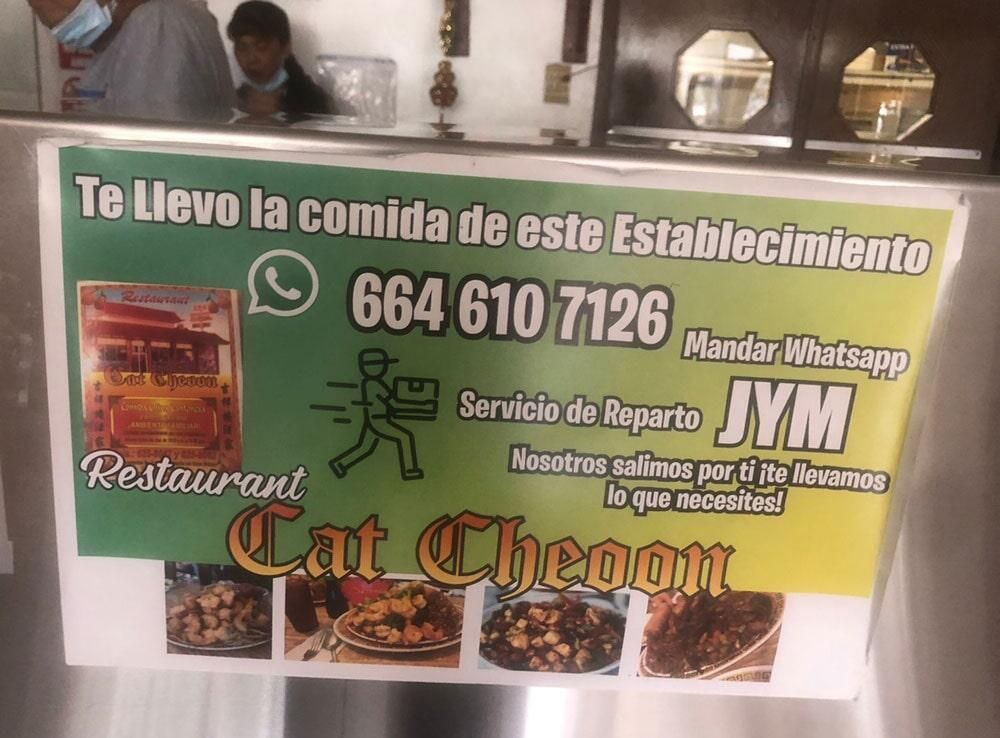 A sign that says te levo la comida de este establecimiento