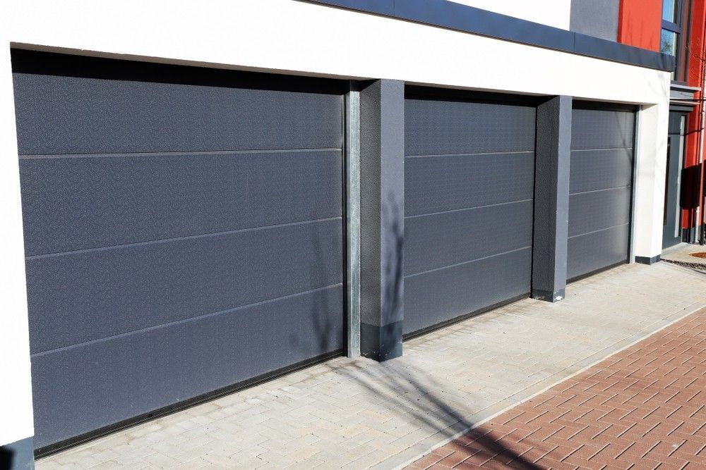 A Row of Garage Doors on The Side of A Building — Gem Garage Doors in Nambucca Heads, NSW