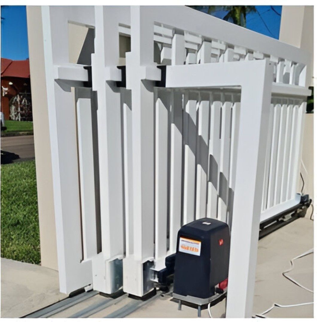 A Sliding Gate with A Motor Attached to It — Gem Garage Doors in Coffs Harbour, NSW