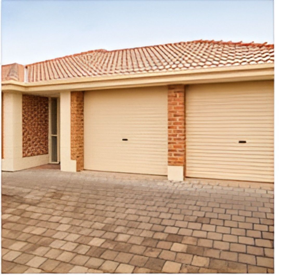 A House with Two Garage Doors and A Brick Wall — Gem Garage Doors in Coffs Harbour, NSW