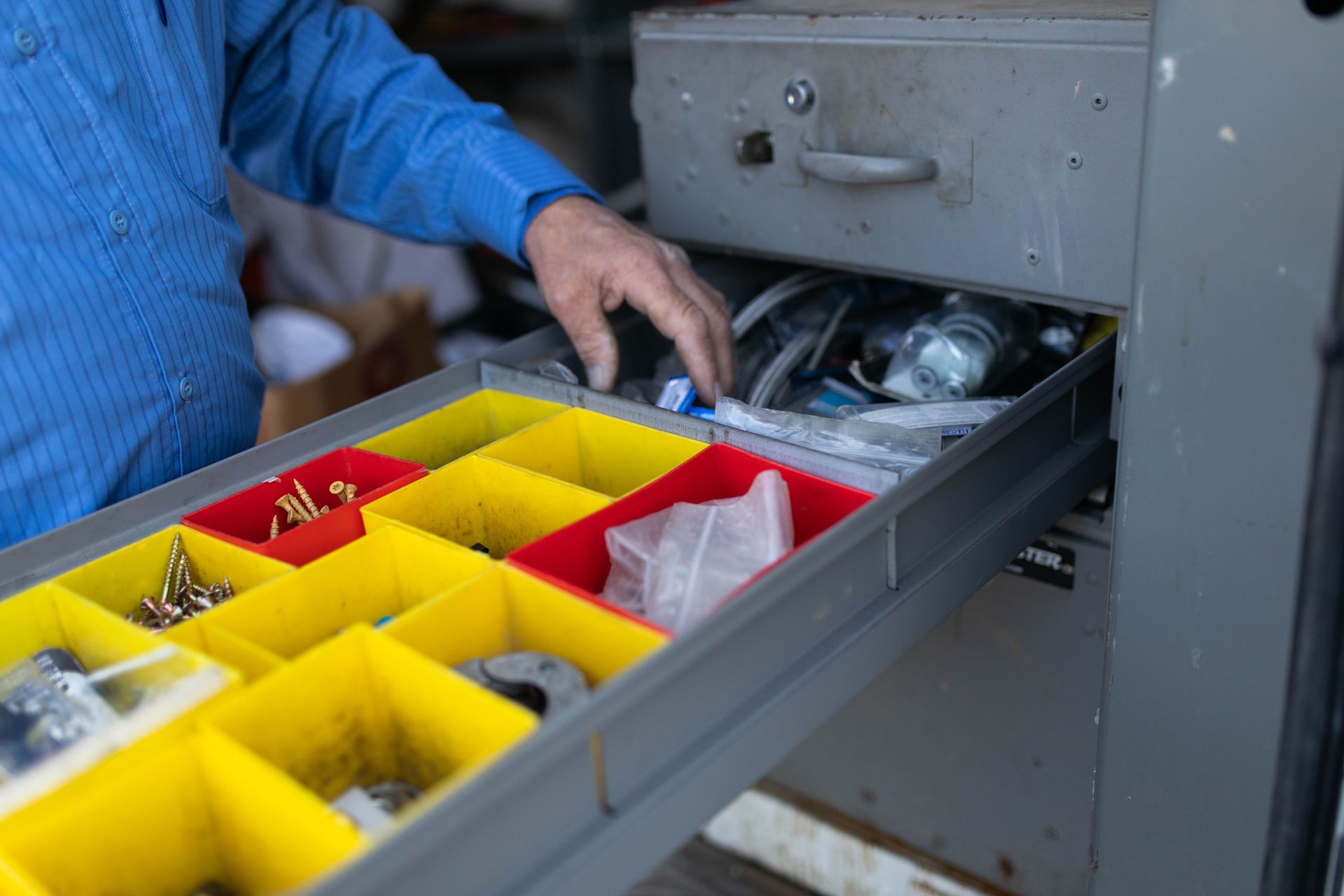 Plumber sorting through piping supplies