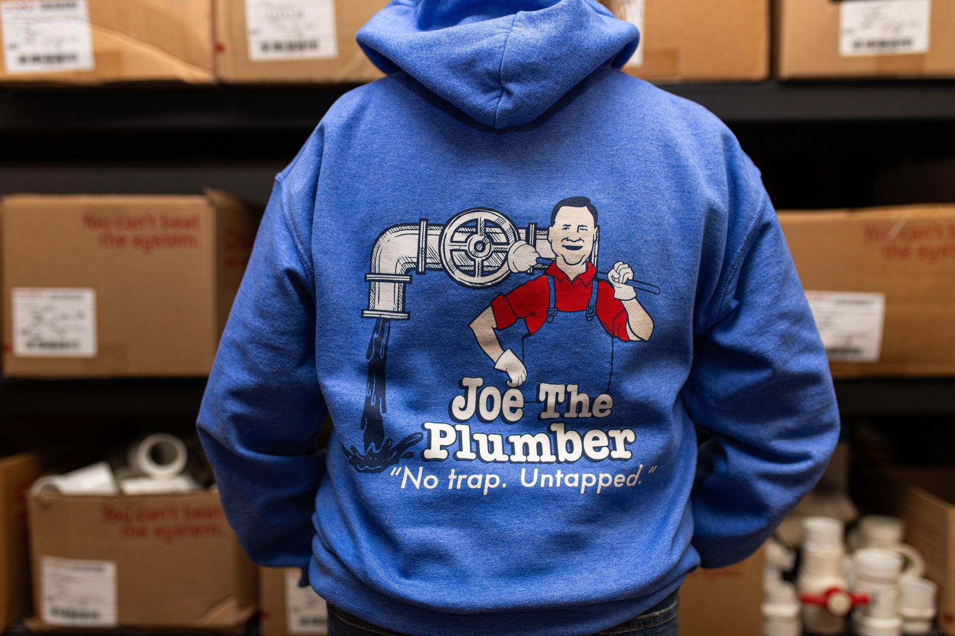 Woman sporting royal blue Joe the Plumber hoodie