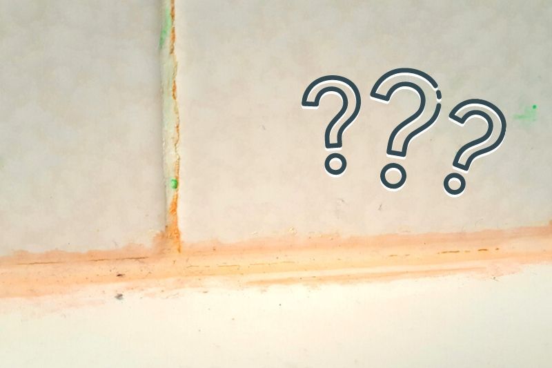 orange ion residue n gray shower tile with question mark graphics 