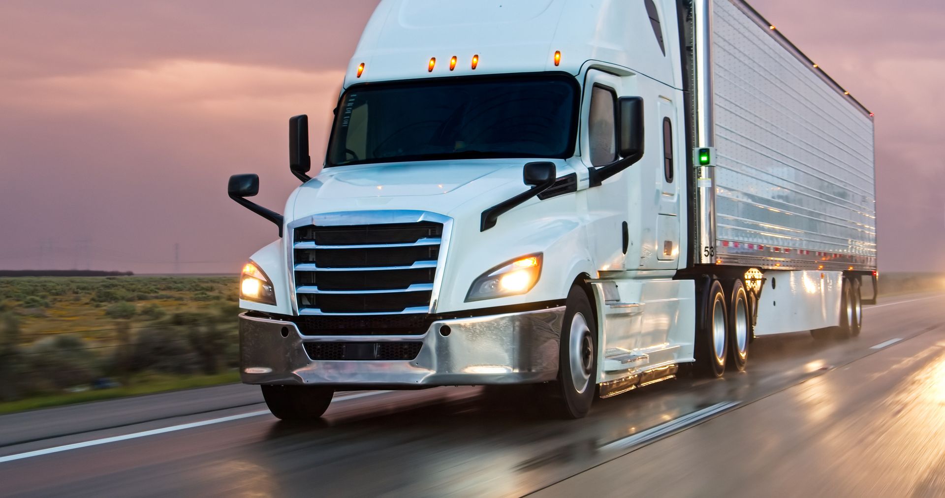 A semi-truck driving south on Interstate 5