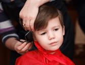 Child Getting Haircut - Hairstyling Services