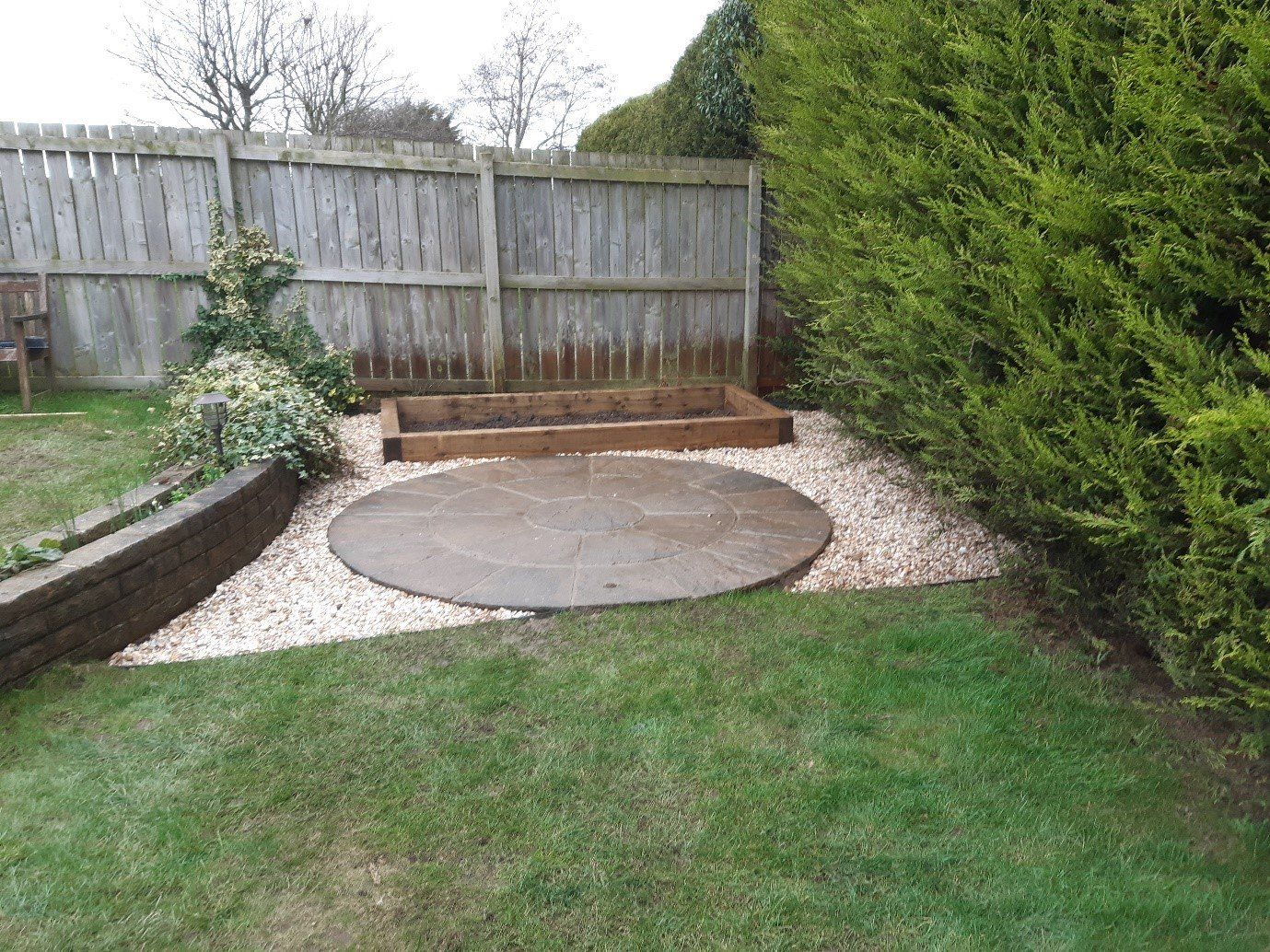stone circle cleaned and raised bed planter installed