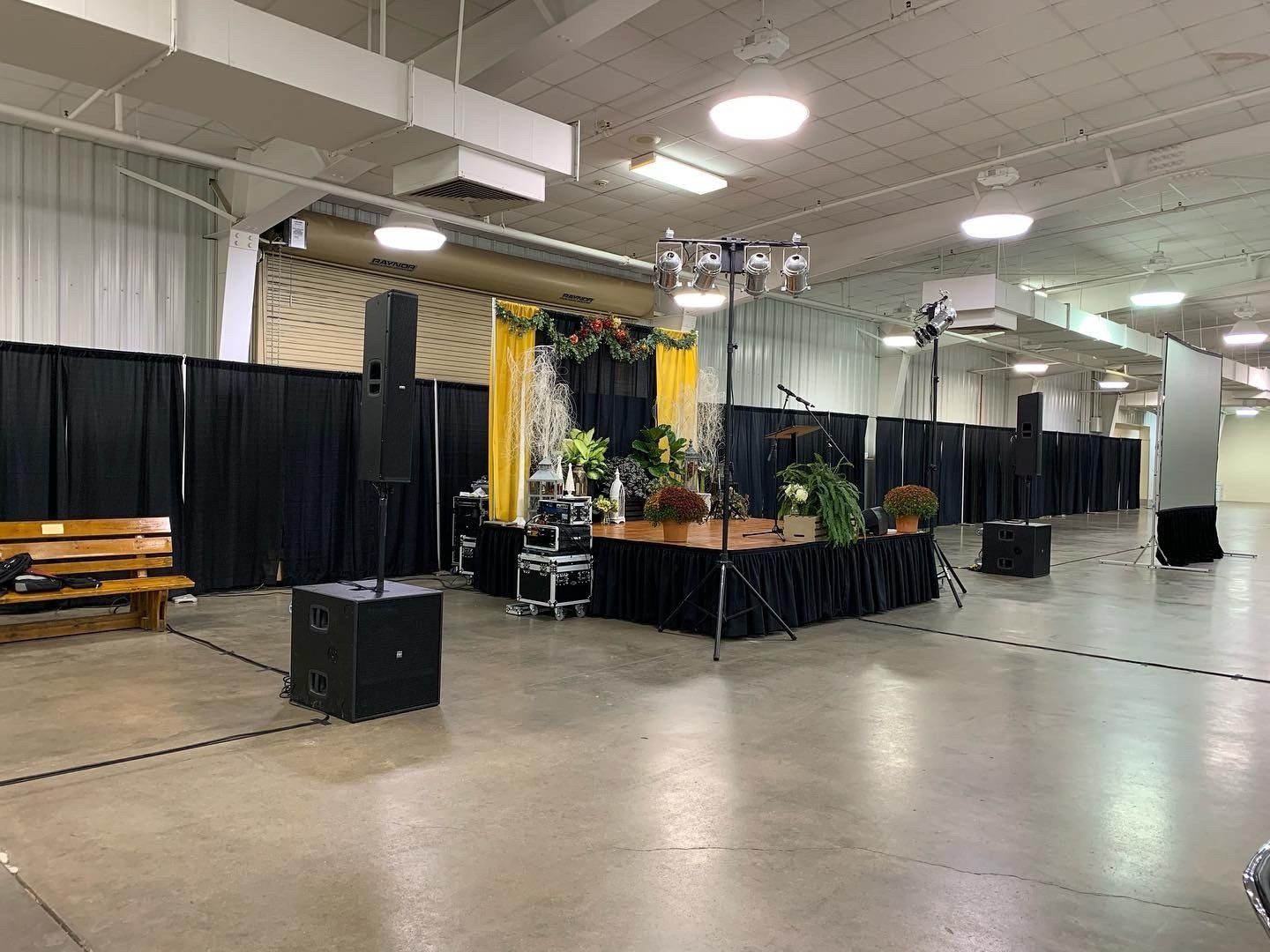 corporate event stage setup with backdrops and audio equipment