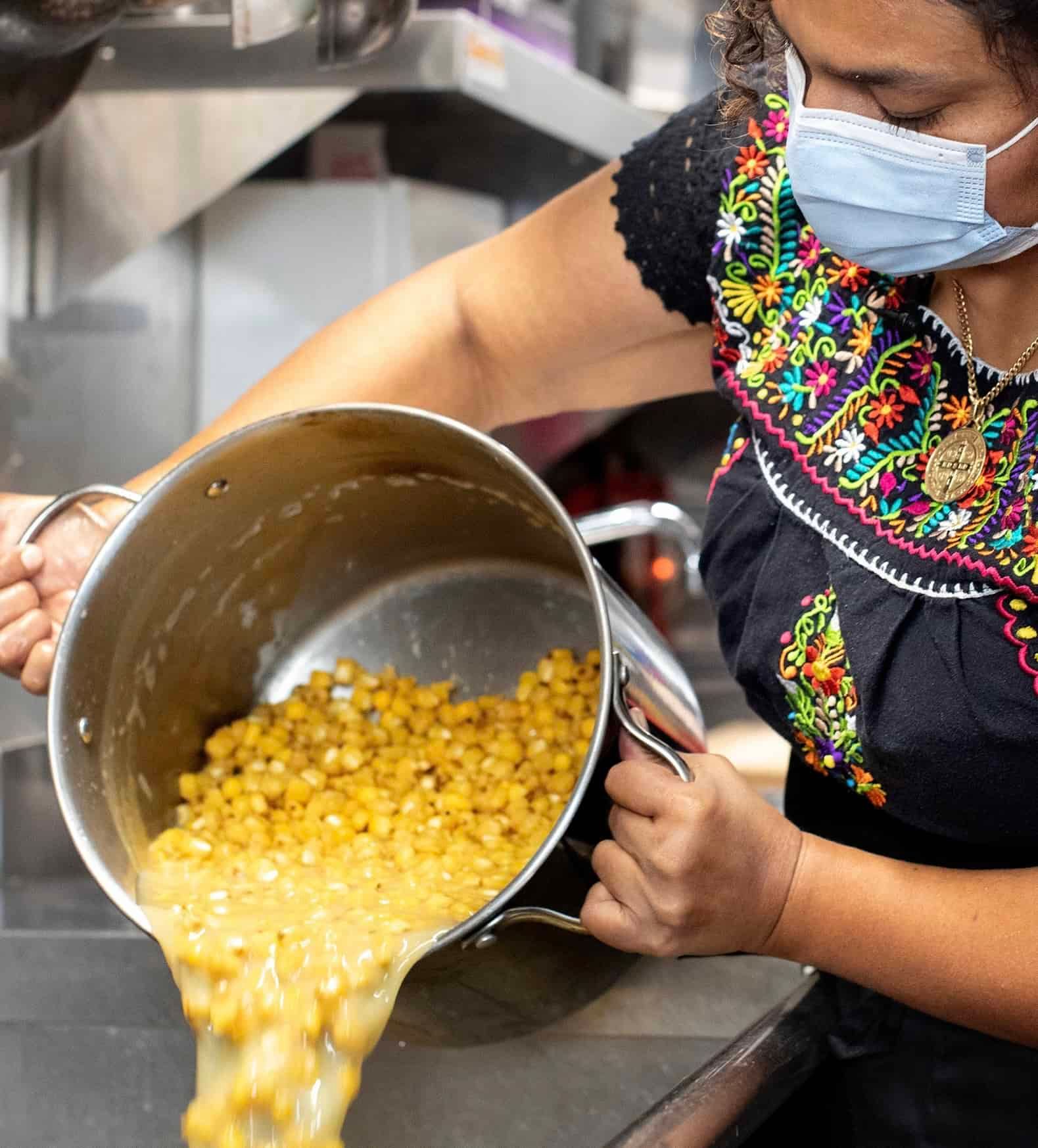 A female chef working at the kitchen