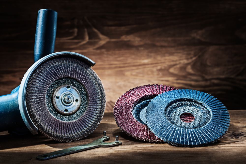 A Grinder Is Sitting on A Wooden Table — Border Bolts & Fasteners in Tweed Heads South, NSW