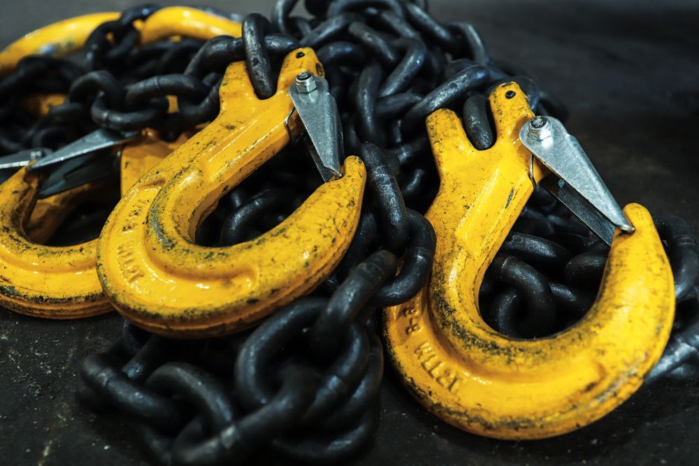 A Bunch of Chains with Yellow Hooks on Them — Border Bolts & Fasteners in Tweed Heads South, NSW