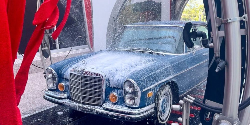 Blue old car in the carwash tunnel