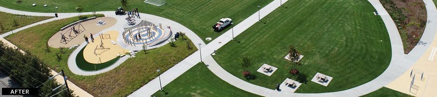 Aerial view of a park with paved walkways, green grass, and playground.