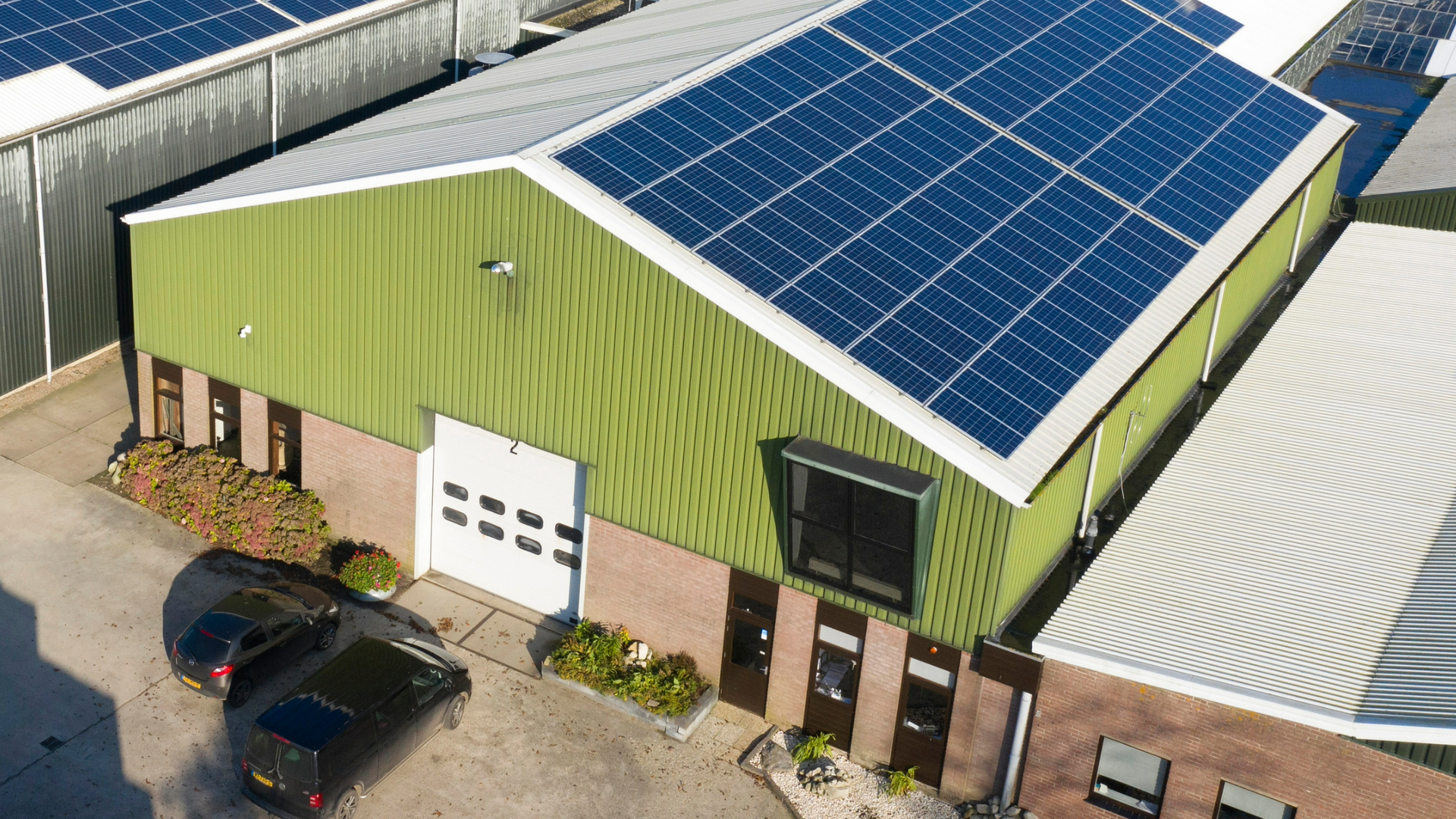 a metal structure with solar panels on the roof