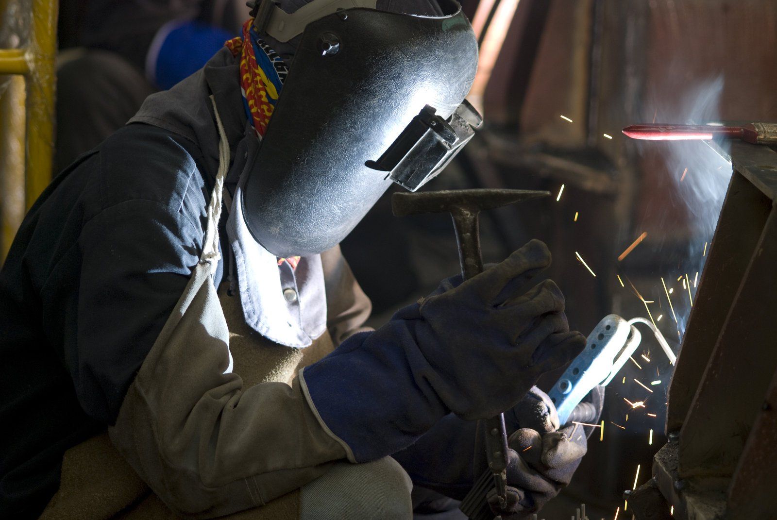worker using a welding tools