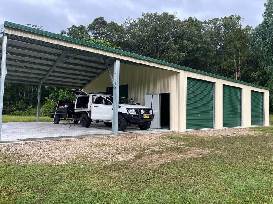 A White Truck is Parked Under a Covered Garage — Mbah Metal Roofing in South Lismore, NSW