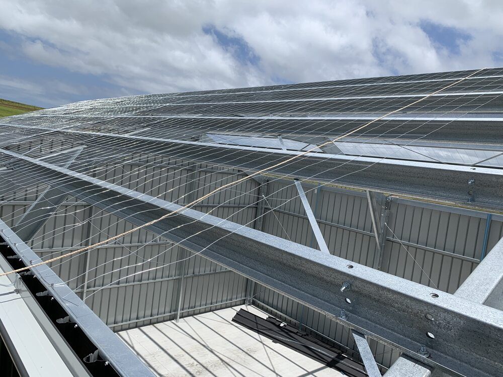 The Roof Of A Building With A Lot Of Solar Panels On It — Mbah Metal Roofing In Murwillumbah, NSW