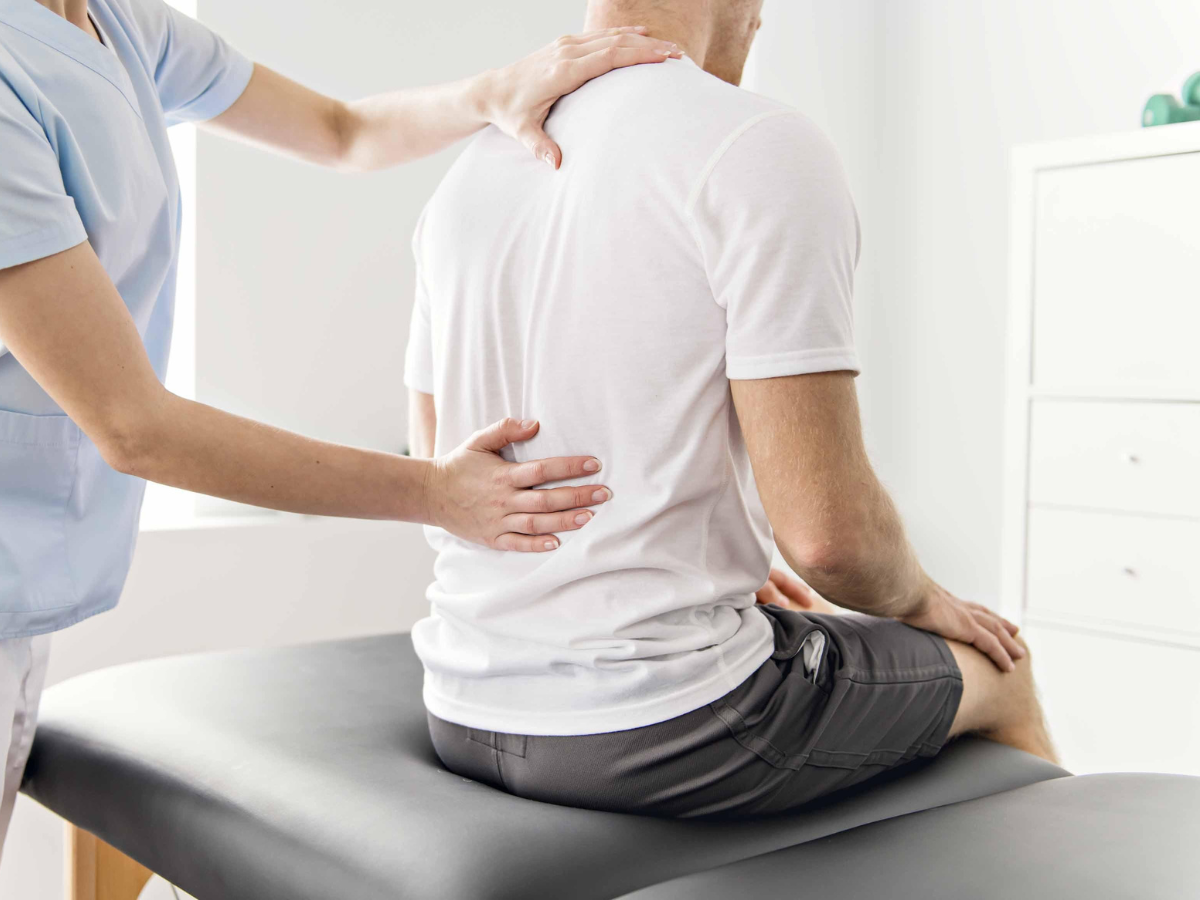 A man treating his back pain