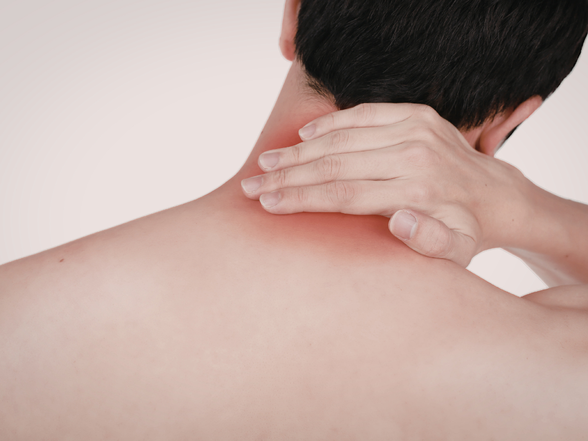 A man holding his neck that having pain