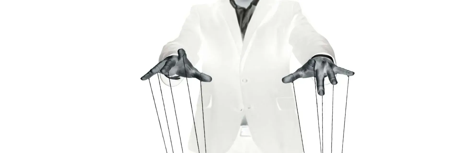 Person in white coat with hands out, holding puppet strings.