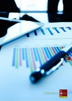 Tablet, pen, and colorful bar graphs on a desk, possibly for business analysis.