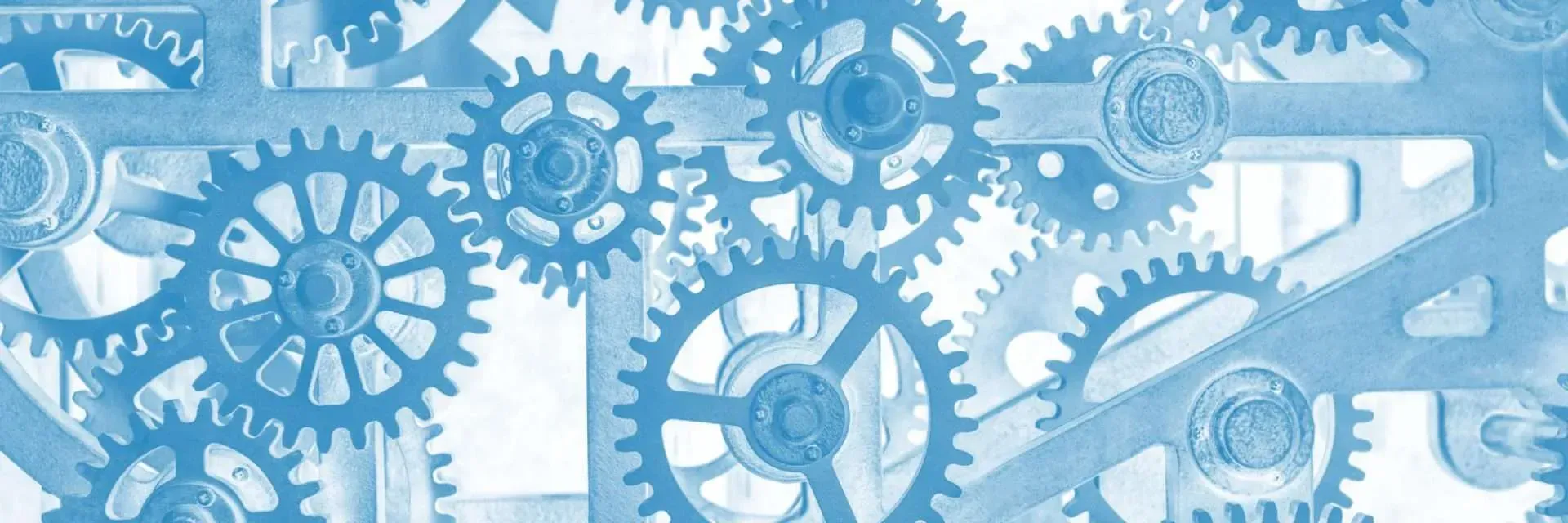 Interlocking gears, blue toned.