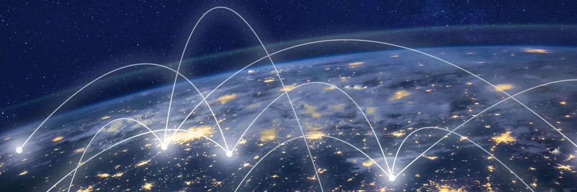 Nighttime Earth with glowing lines representing global connections.
