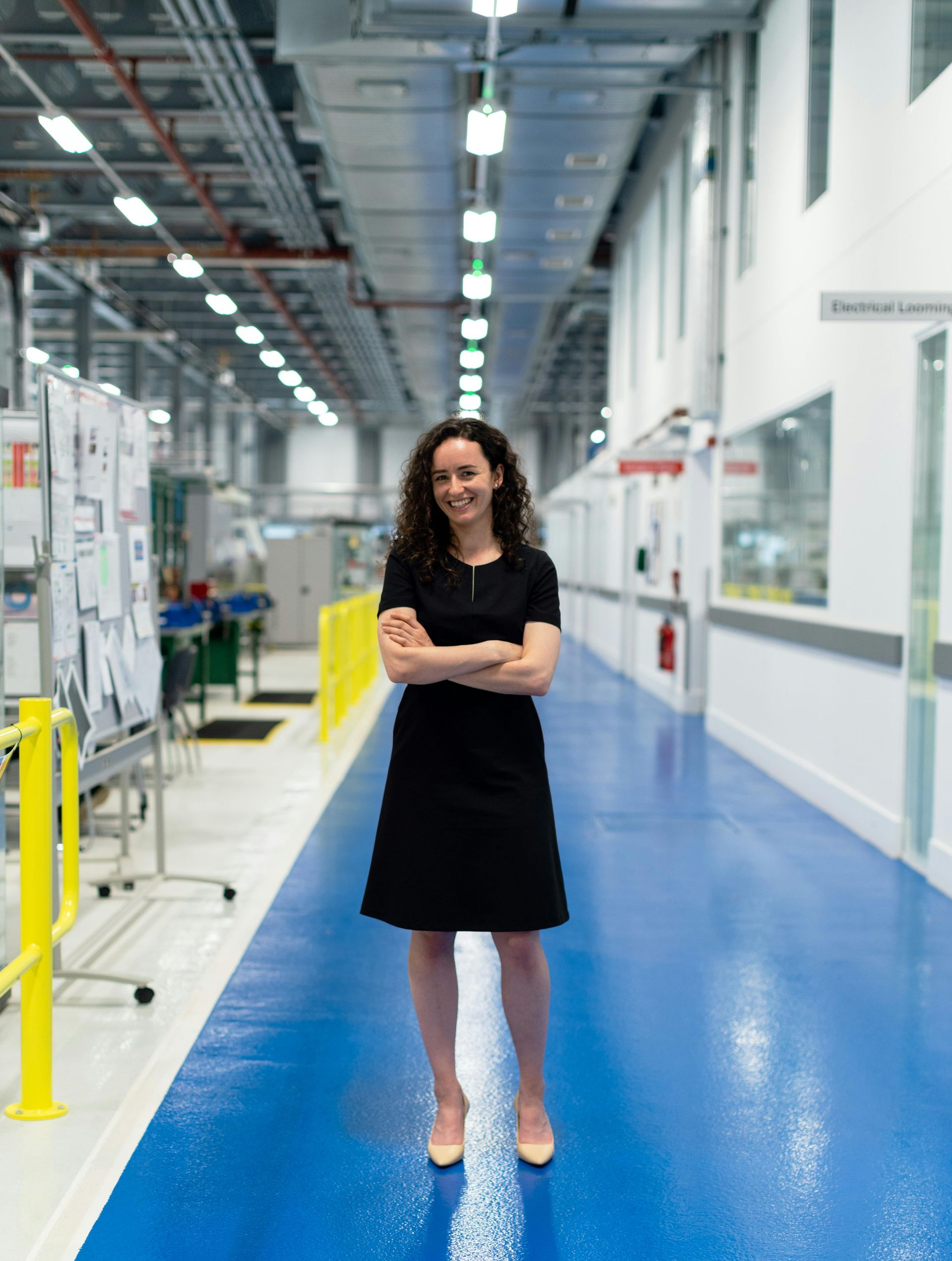 Philadelphia City Hall framed by city buildings. A bus and other vehicles are on the street.