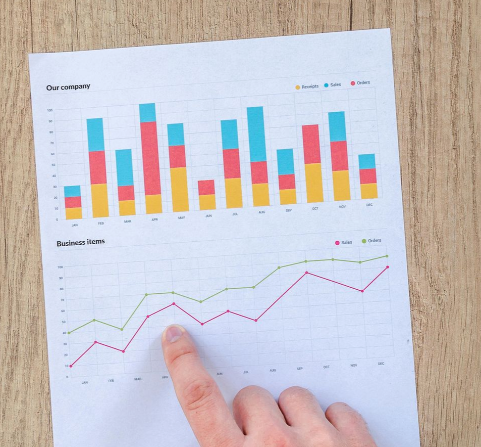 Philadelphia City Hall framed by city buildings. A bus and other vehicles are on the street.