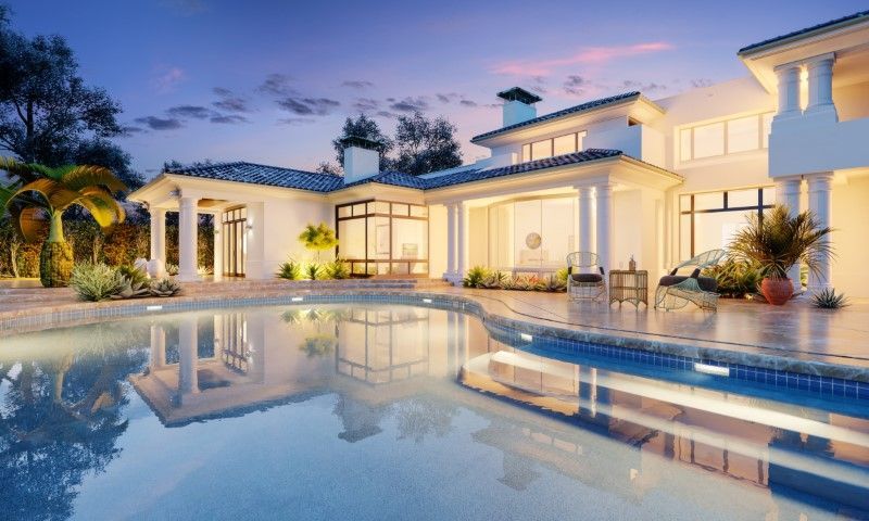 Luxury modern villa with pool at dusk, reflected in still water under a pink-blue sky