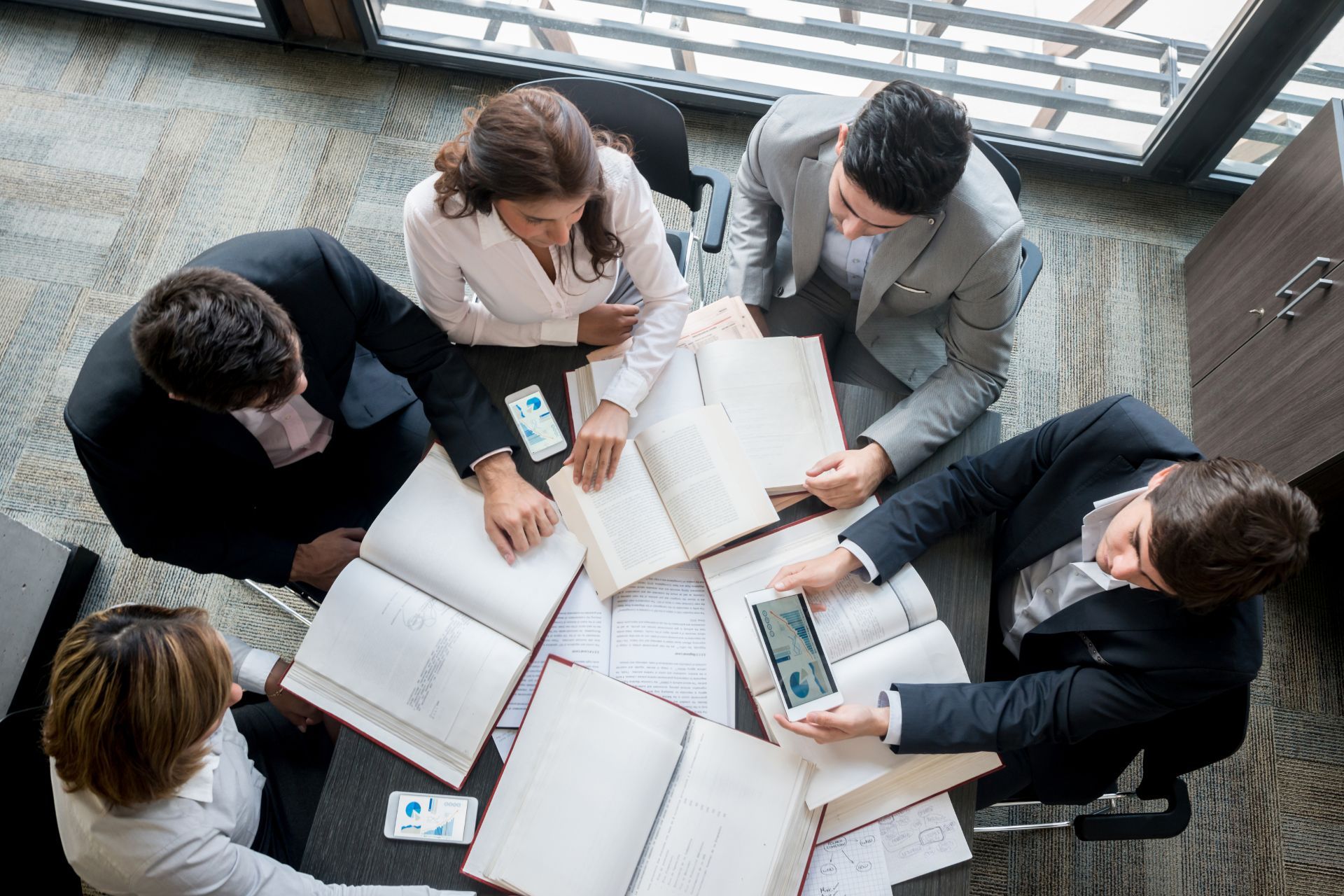people discussing business around a table