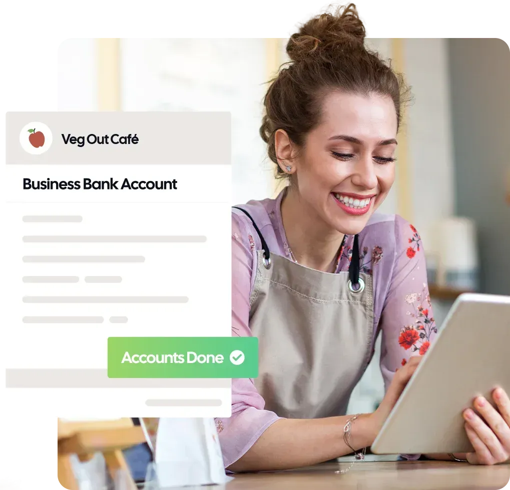 Female restaurant owner checking business accounts on tablet