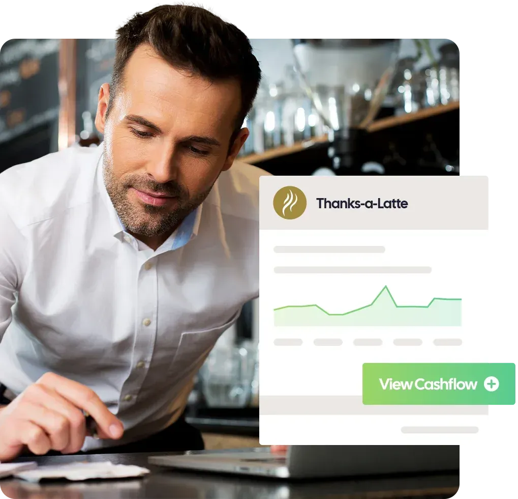 Restaurant owner viewing business cashflow on laptop