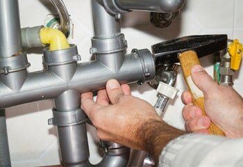 Plumber Checking Pipes — Pipe Installation in Stamford, CT