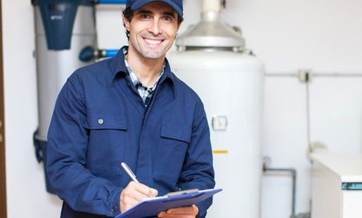 Technician Servicing an Hot-Water Heater — Heating Repairs in Stamford, CT