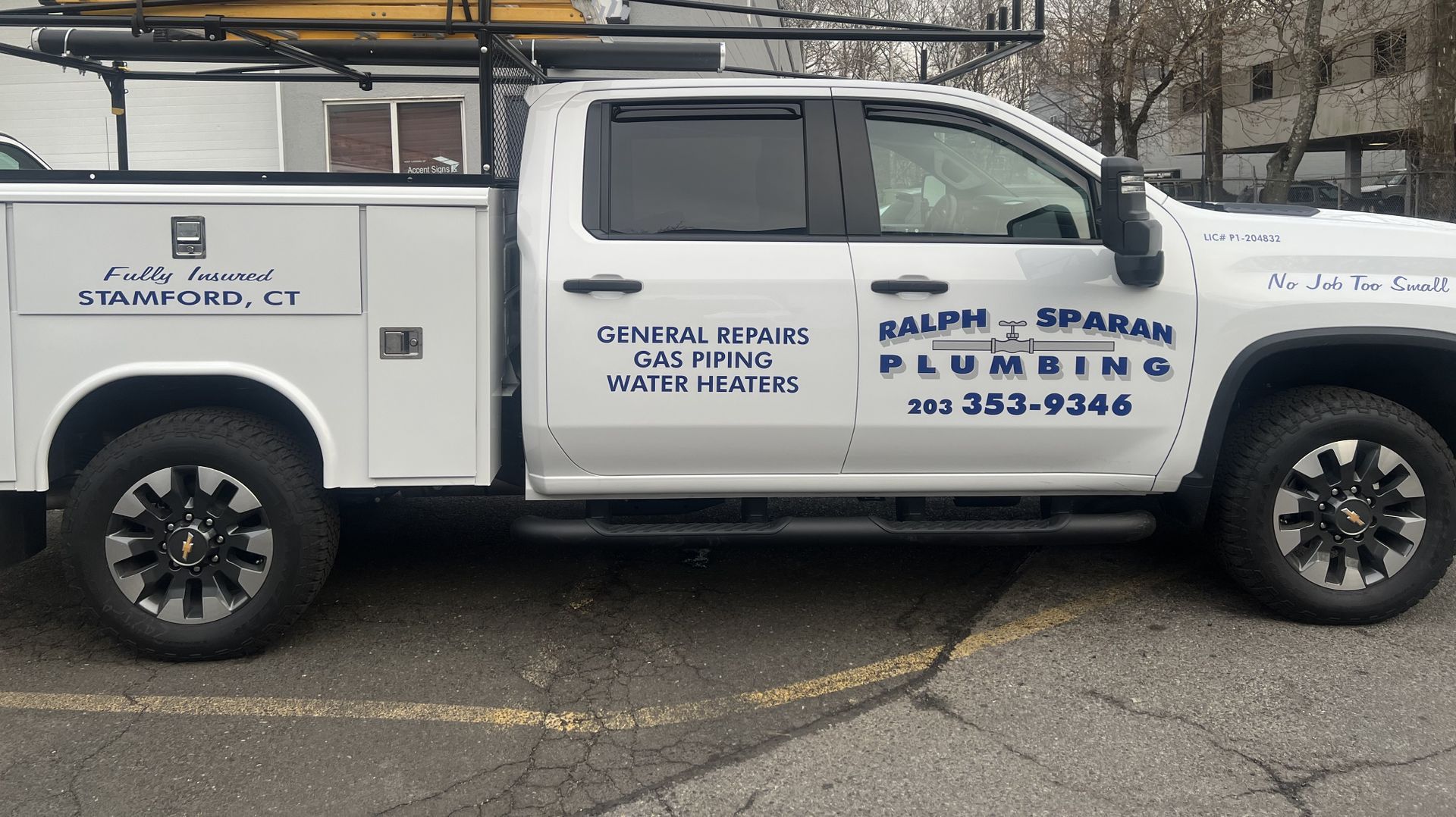 Technician Servicing an Hot-Water Heater — Heating Repairs in Stamford, CT Technician Servicing an Hot-Water Heater — Heating Repairs in Stamford, CT