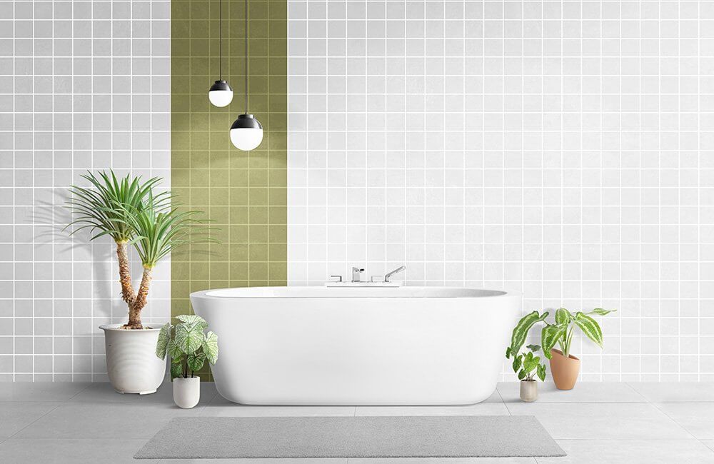A bathroom with a bathtub and potted plants.