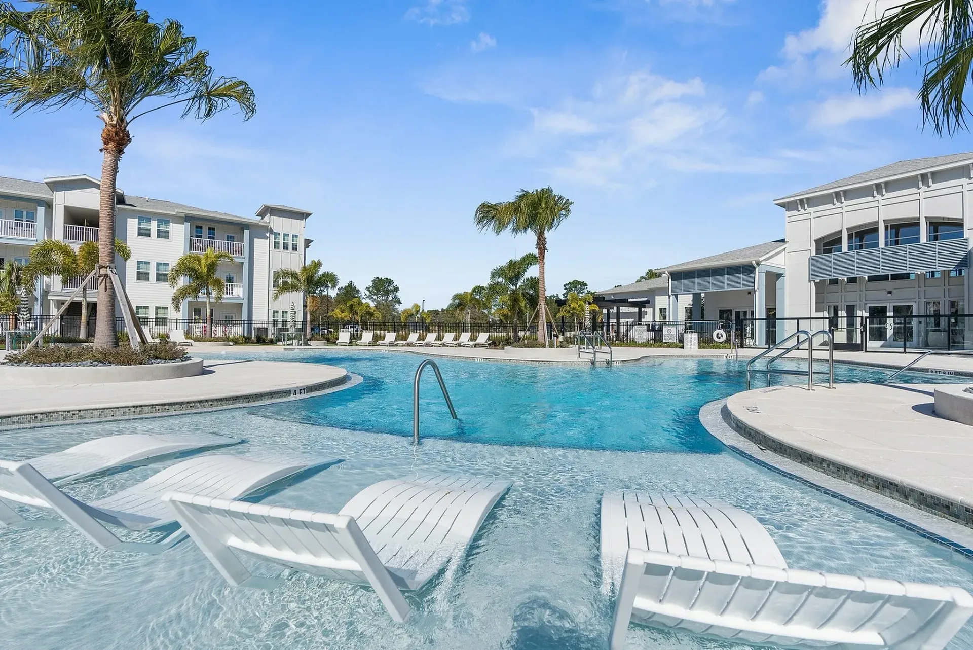 Experience the ultimate in relaxation and style by the luxurious poolside at our modern apartments.