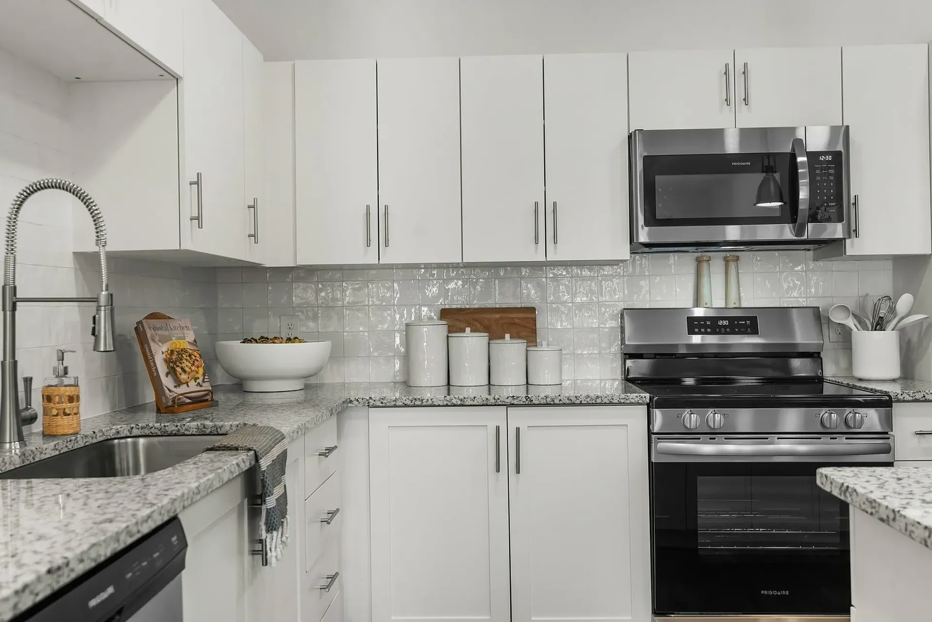 Experience culinary delight in this beautifully designed kitchen, combining style and functionality.