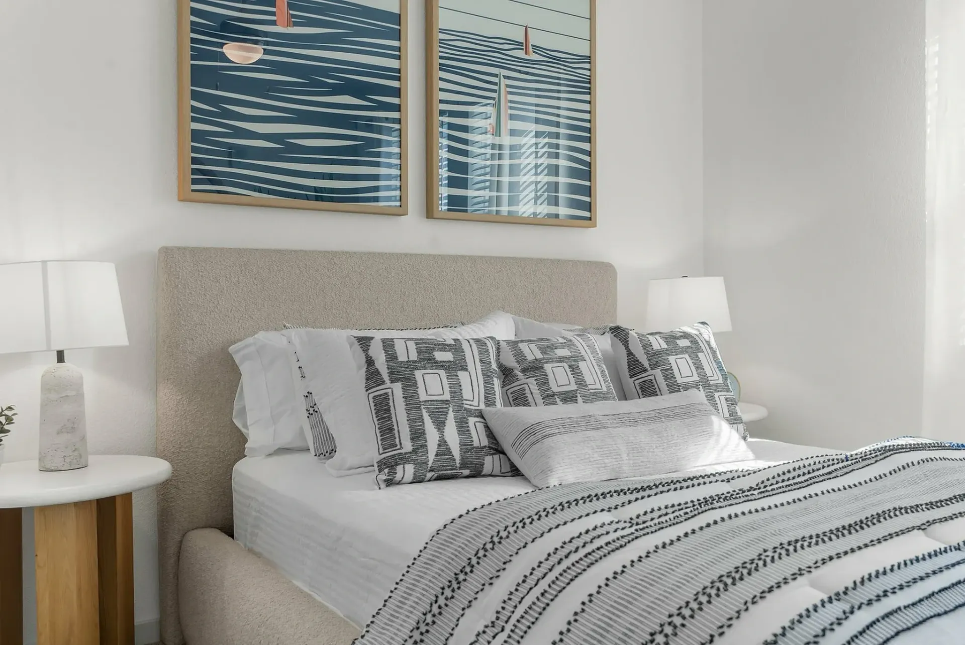 Relax in this serene and stylish bedroom, complete with modern decor and comfort.