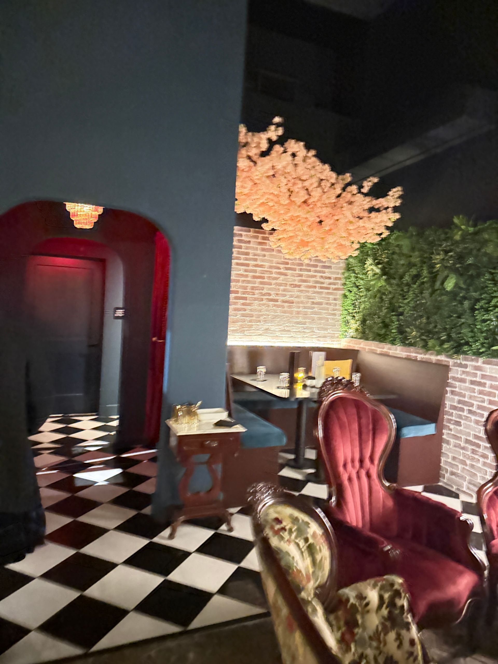 Checkered flooring and lovely seating at Kin Bar in downtown Gainesville