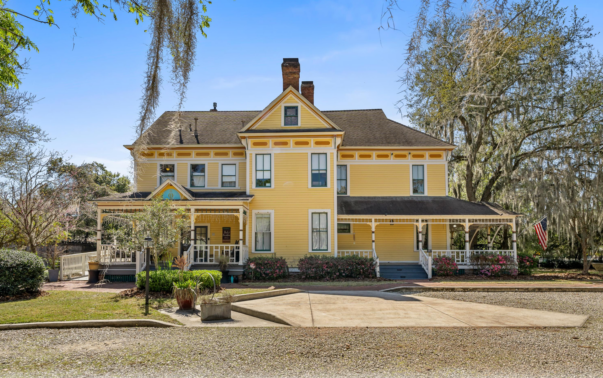 3 story yellow Victorian Home