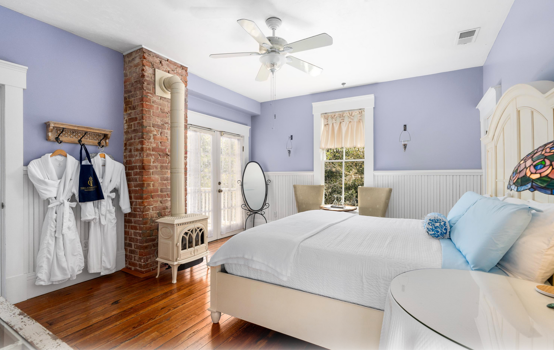 Bedroom with bed and fireplace
