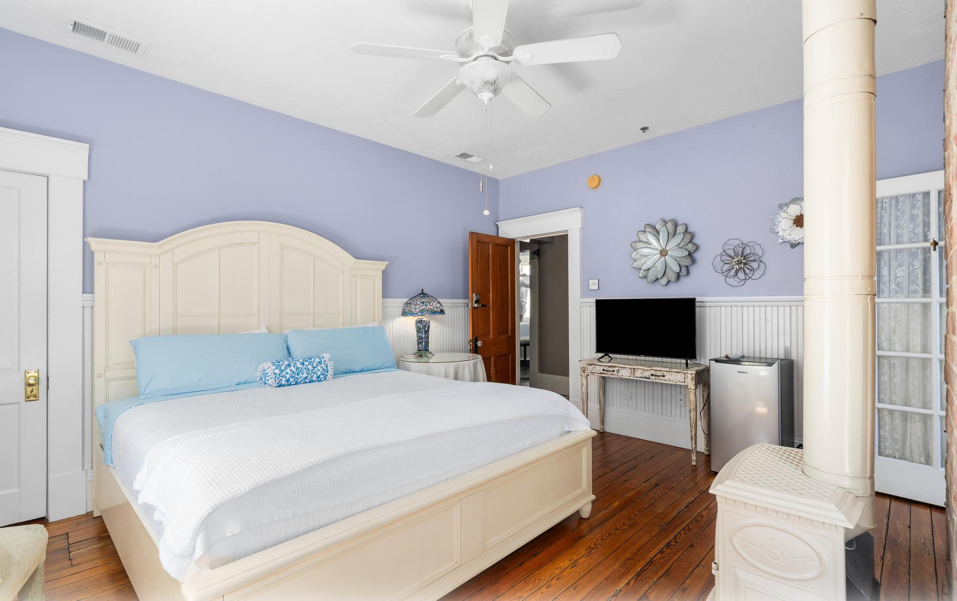 Bedroom with bed and fireplace