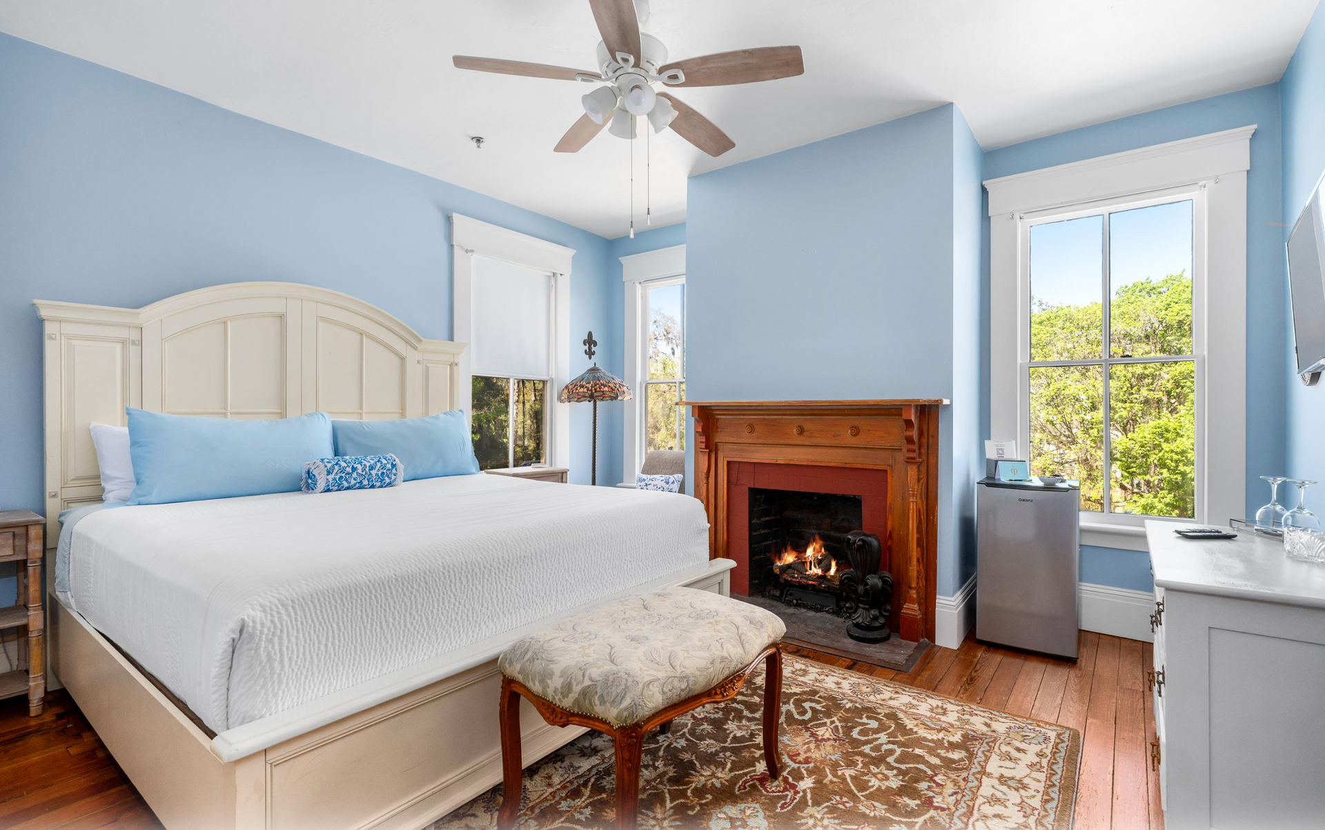 Bedroom with bed and fireplace