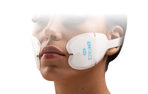 A woman is wearing a device on her face.