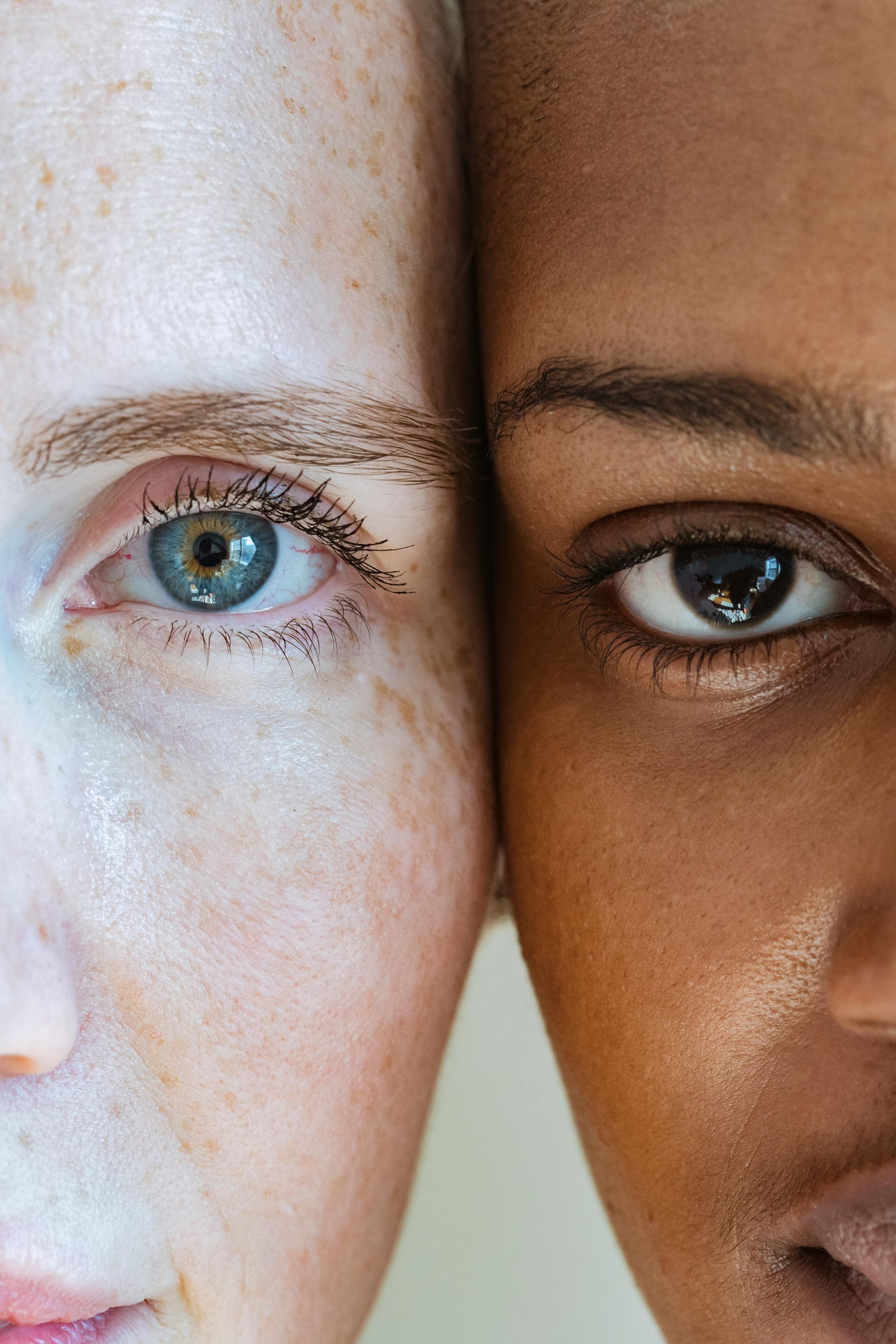 A close up of two women 's faces next to each other.