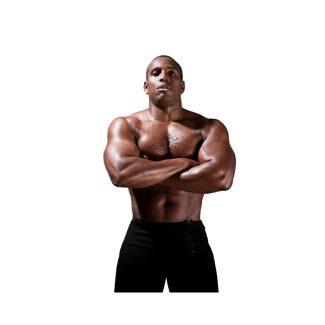 A shirtless man with his arms crossed is standing in front of a white background.