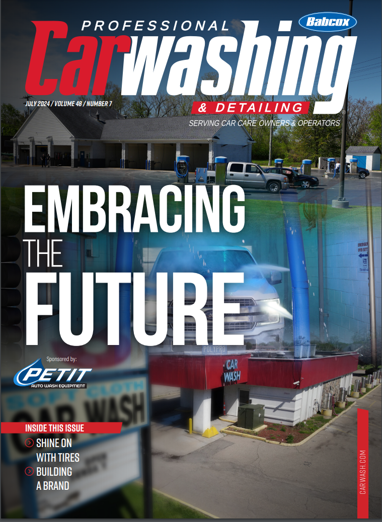 The cover of a car washing magazine shows a car being washed at a car wash.