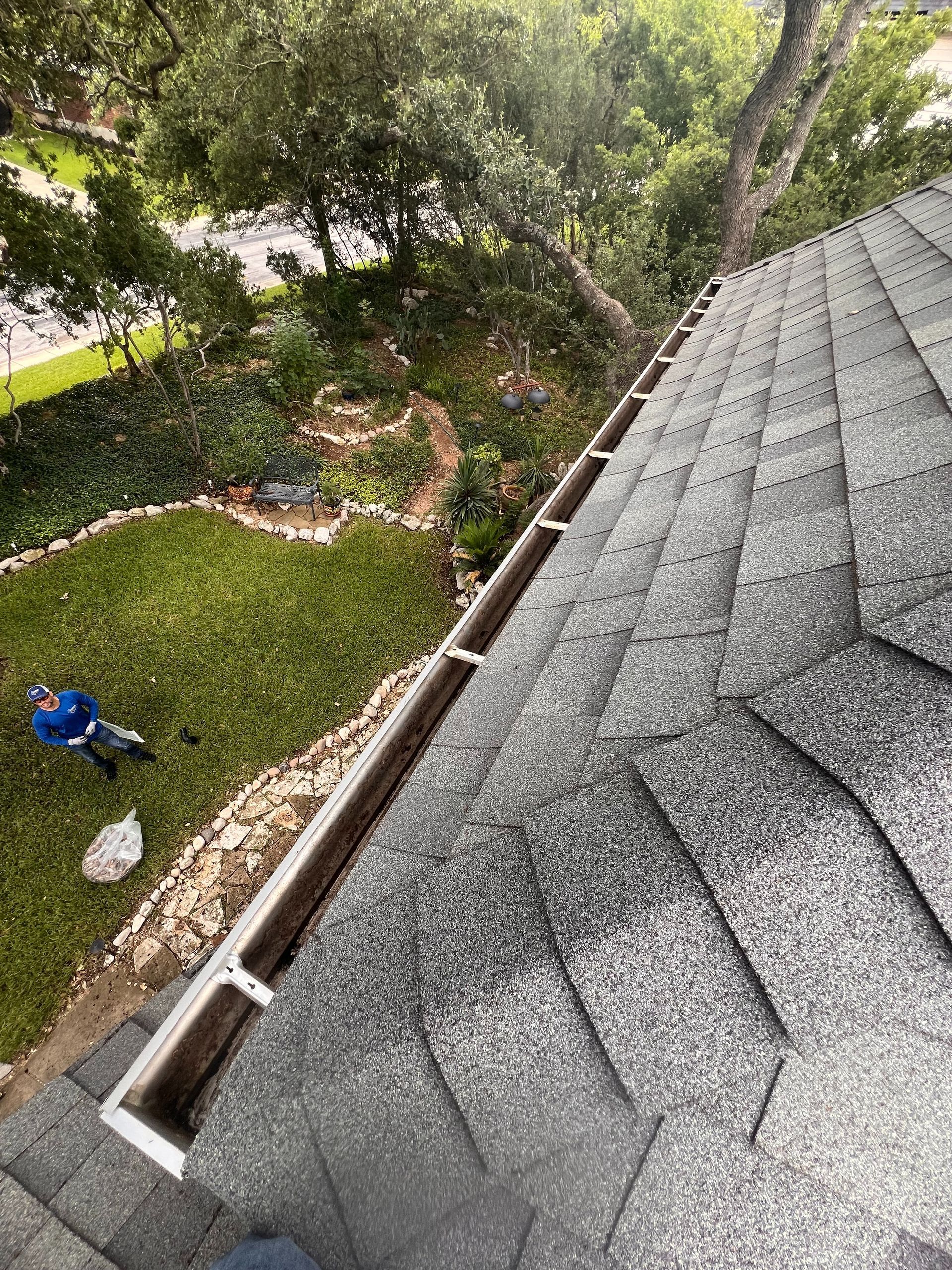 An aerial view of a roof with a gutter on it.